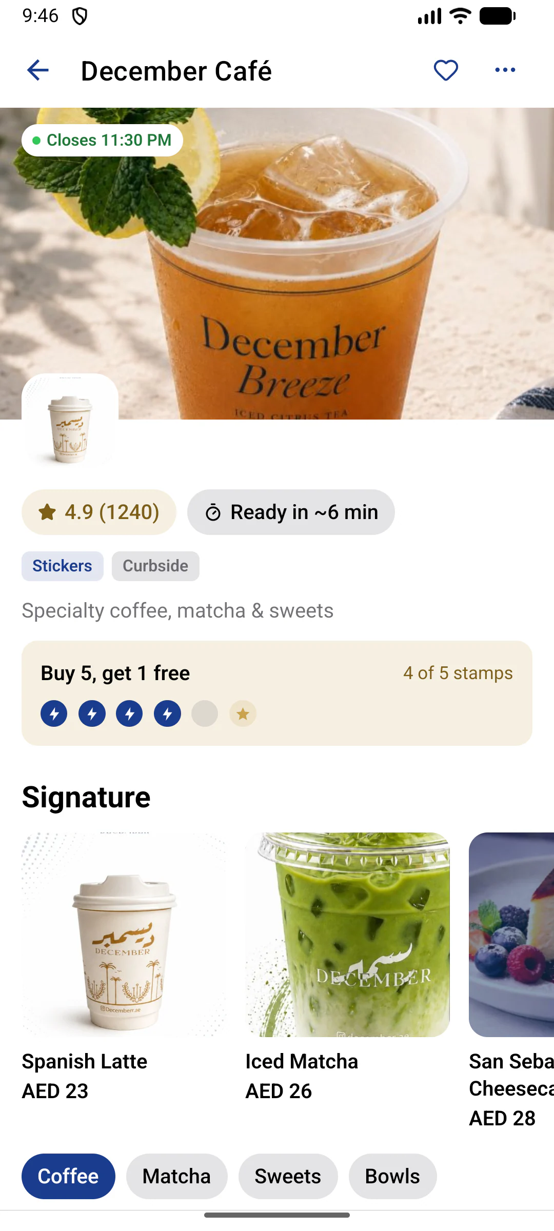 Store page for a demo café: rating, a ready-time estimate, sticker and curbside badges, a stamp card at 4 of 5 and signature items with prices